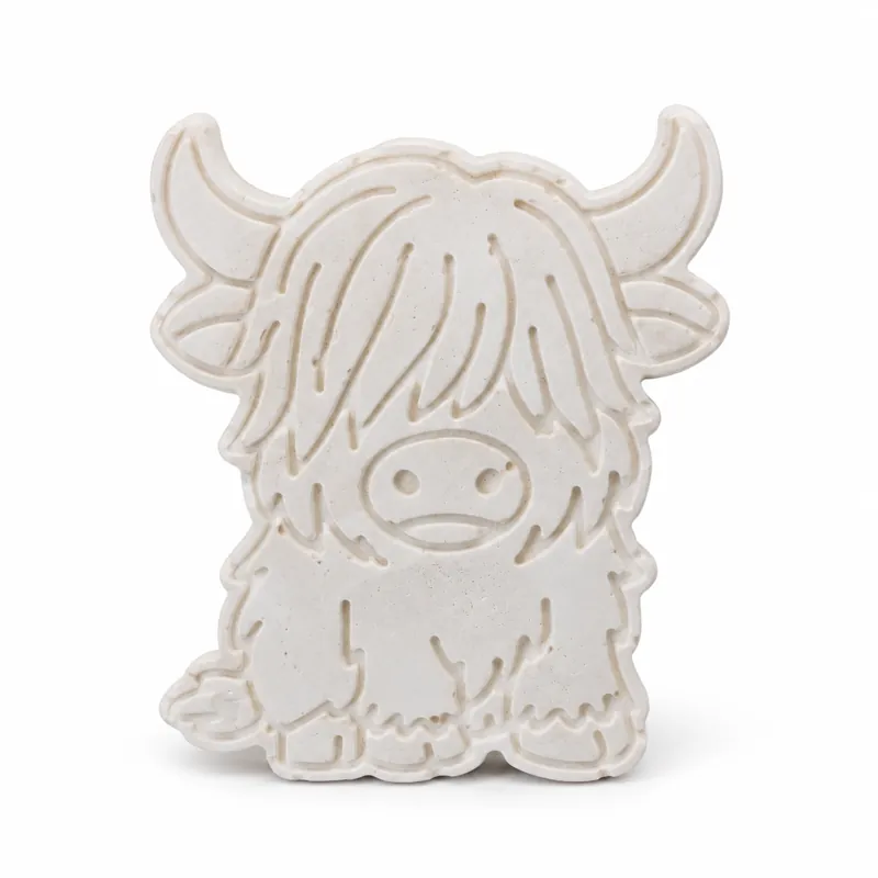 Unpainted Classic Highland Cow plaster figure on a white background