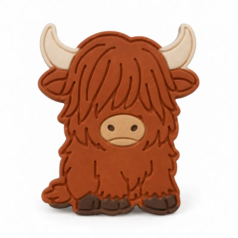 Painted Petite Highland Cow plaster figure on a white background; color inspiration only