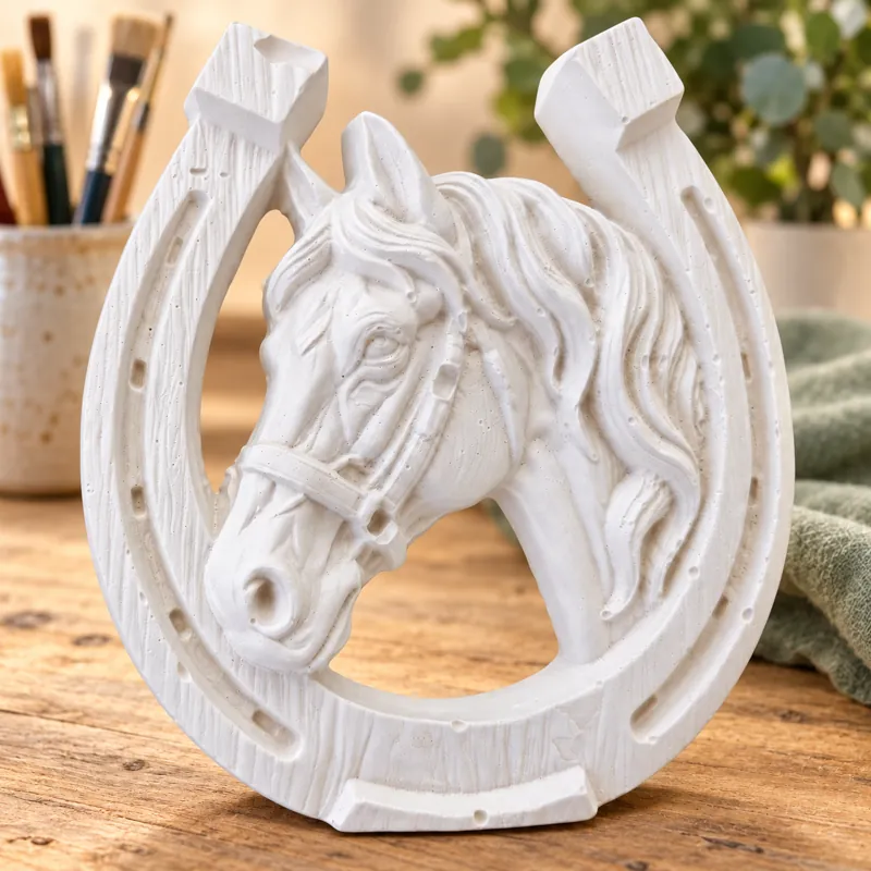 Unpainted Horse Portrait Horseshoe plaster figure on a craft table