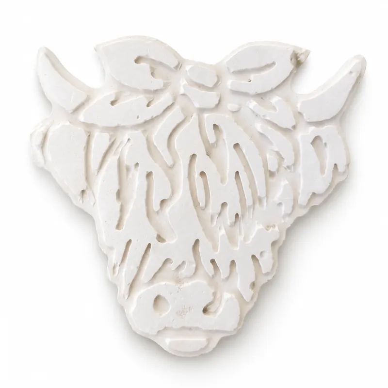 Unpainted Highland Cow Portrait plaster figure on a white background