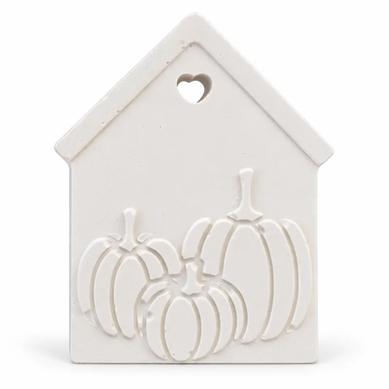 Unpainted Pumpkin Cottage Plaque plaster figure on a white background