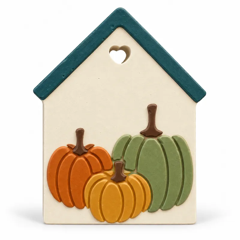 Painted Pumpkin Cottage Plaque plaster figure on a white background; color inspiration only
